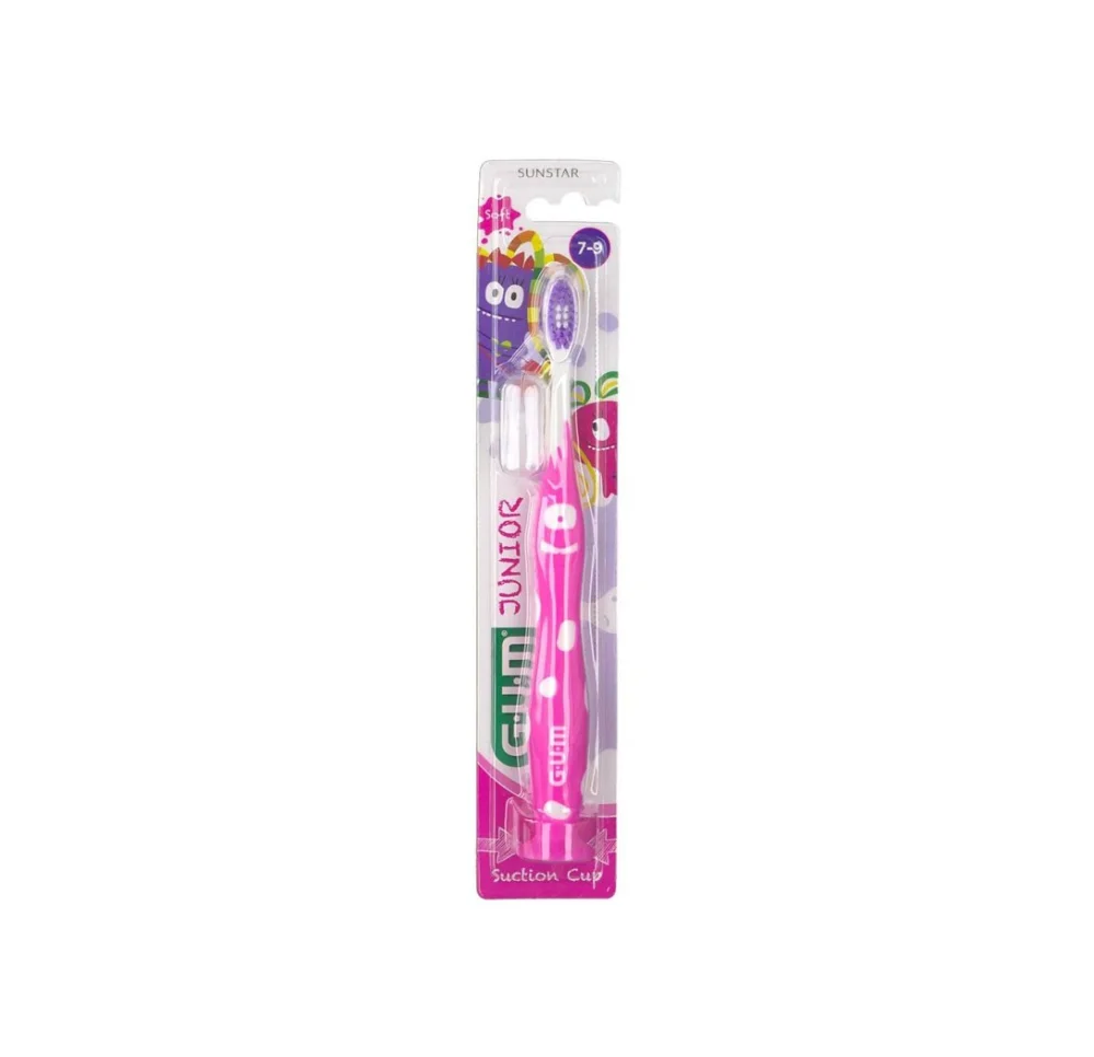 Brosse à dents en plastique souple avec poils doux de couleur rose. GUM Junior